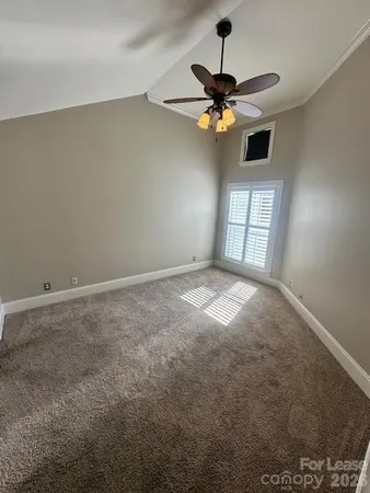 a view of empty room with windows