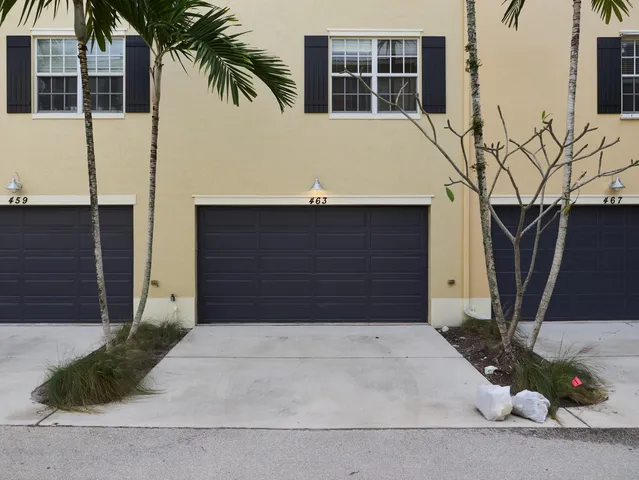 a front view of a house with garage