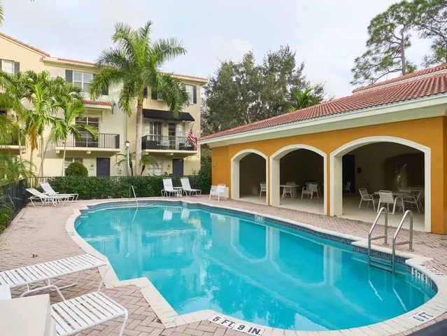 a view of a swimming pool with a patio