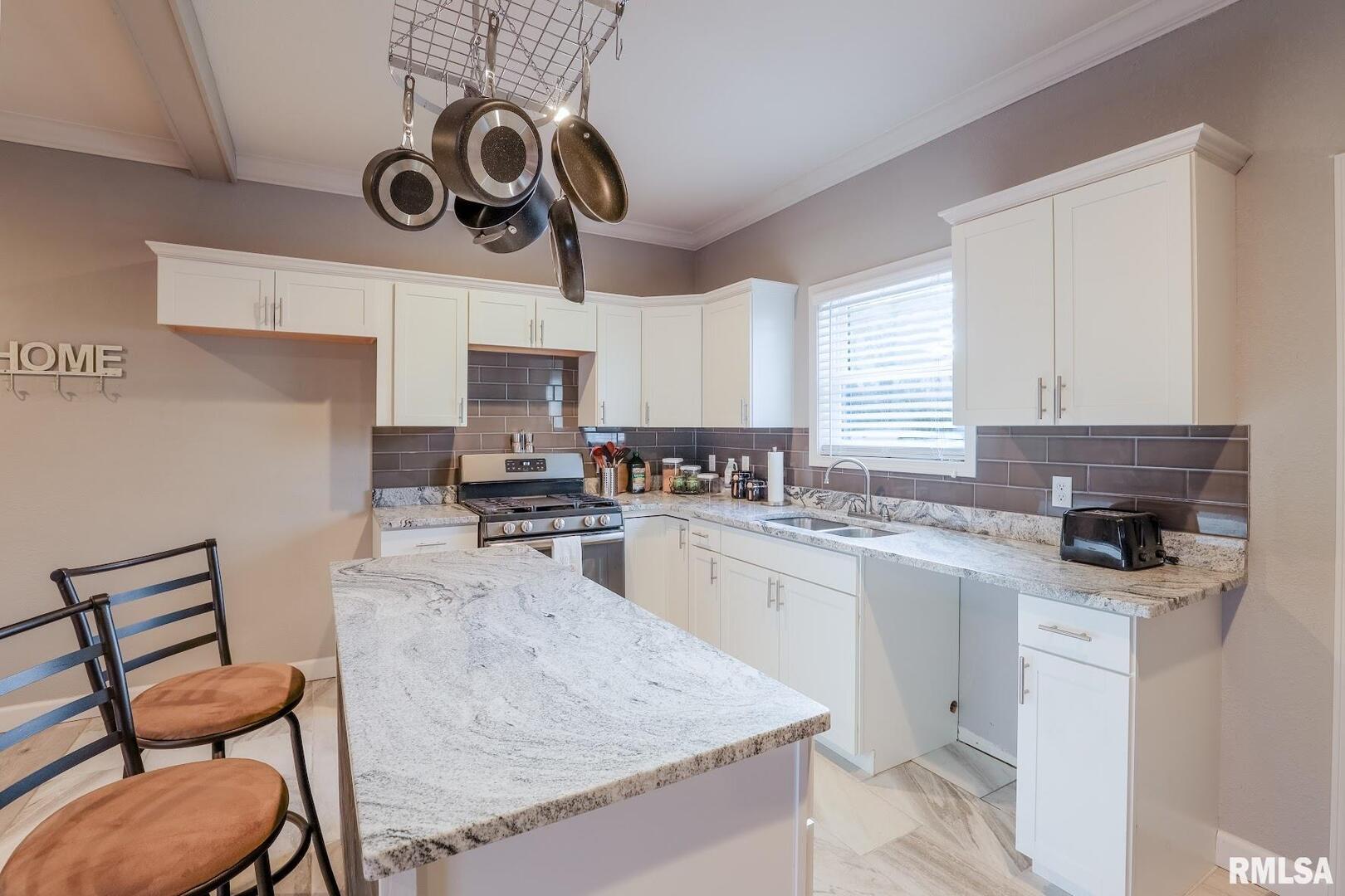 0 Bolen Store Road Thompsonville, IL 62890 - Photo 12 of 52 a kitchen with a stove cabinets and chairs