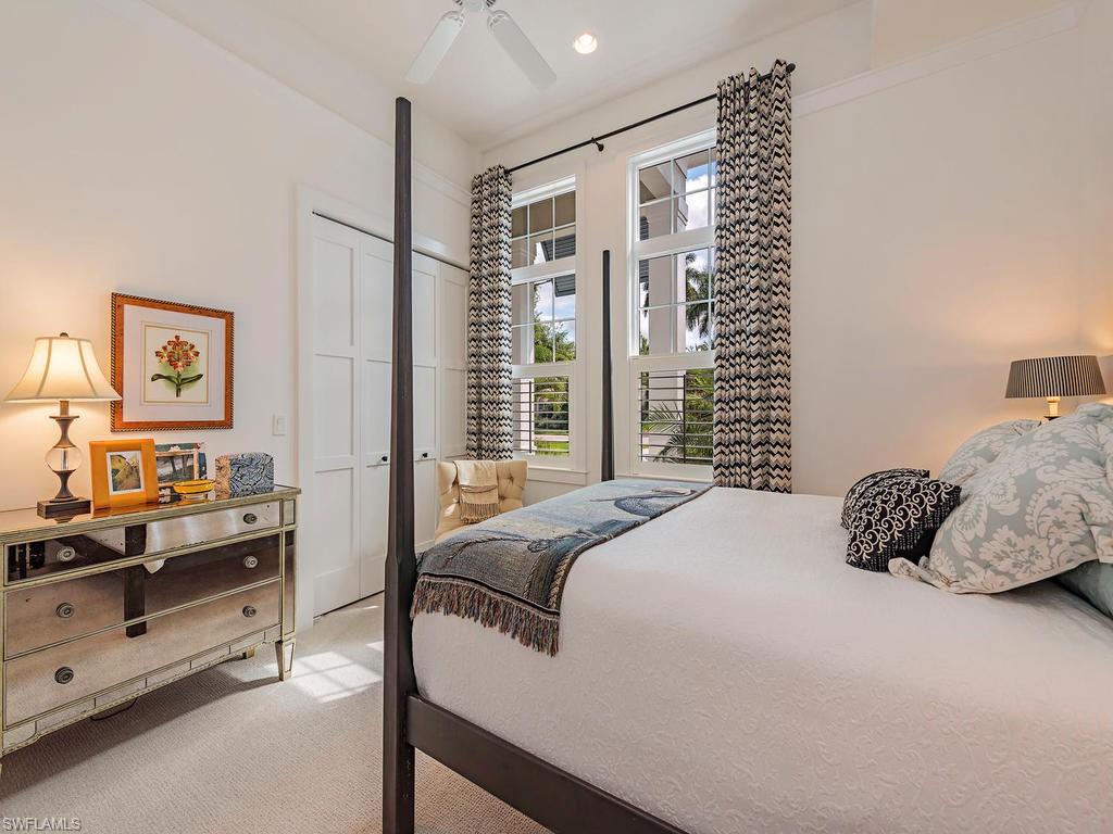 2305 Harrier Run Naples, FL 34105 - Photo 11 of 15 a bedroom with a bed and a night stand