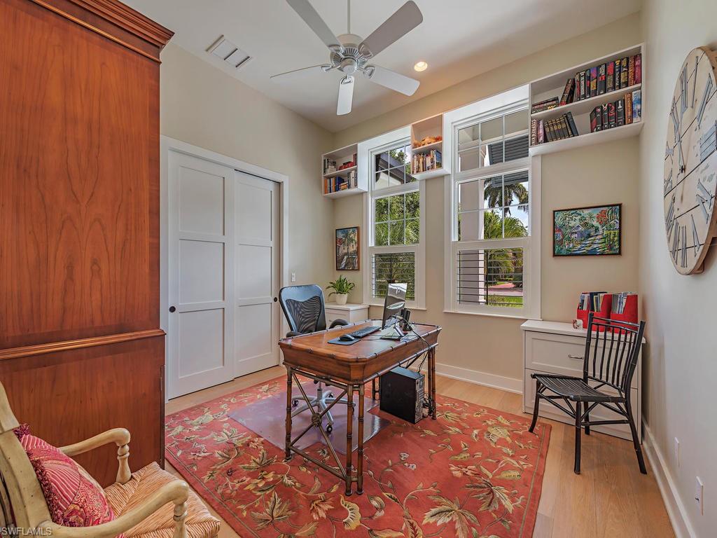 2305 Harrier Run Naples, FL 34105 - Photo 12 of 15 a work room with furniture and a window