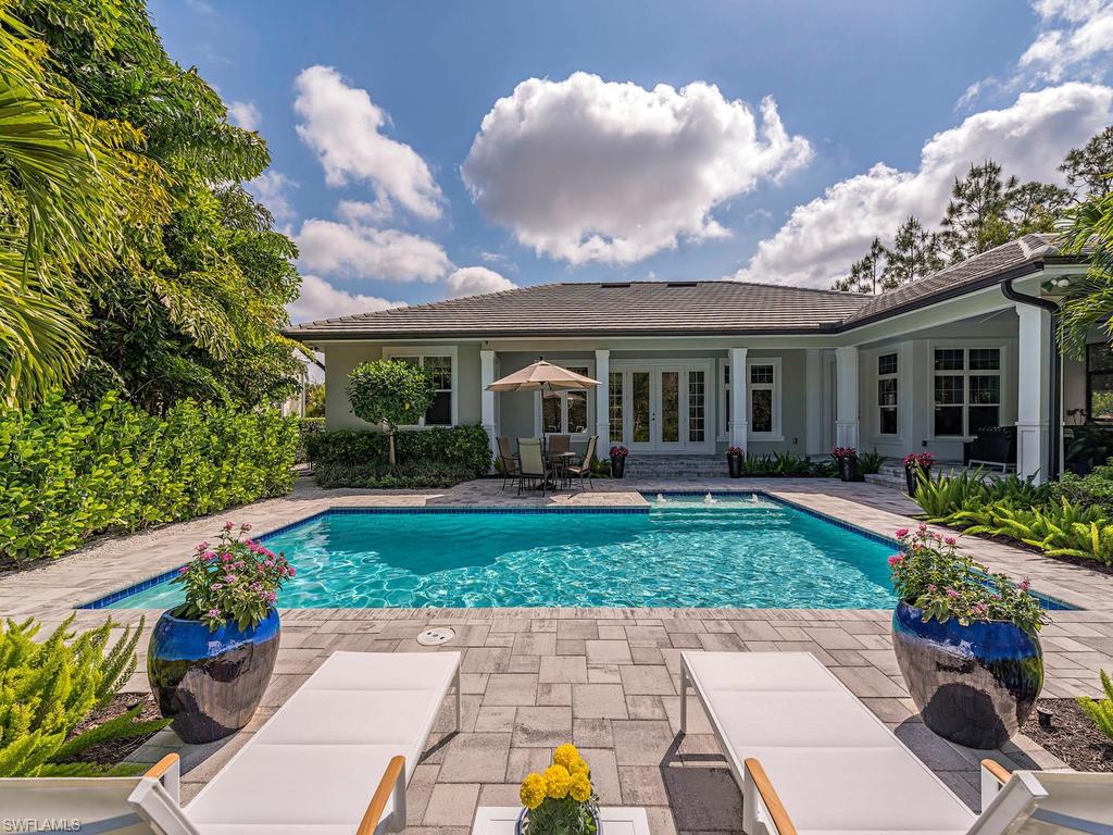 2305 Harrier Run Naples, FL 34105 - Photo 14 of 15 a view of a house with a garden