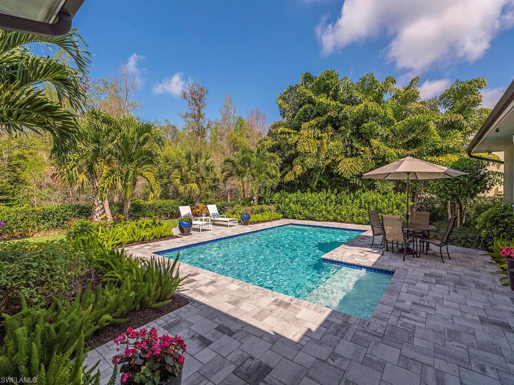 2305 Harrier Run Naples, FL 34105 - Photo 15 of 15 a view of a garden with an outdoor seating