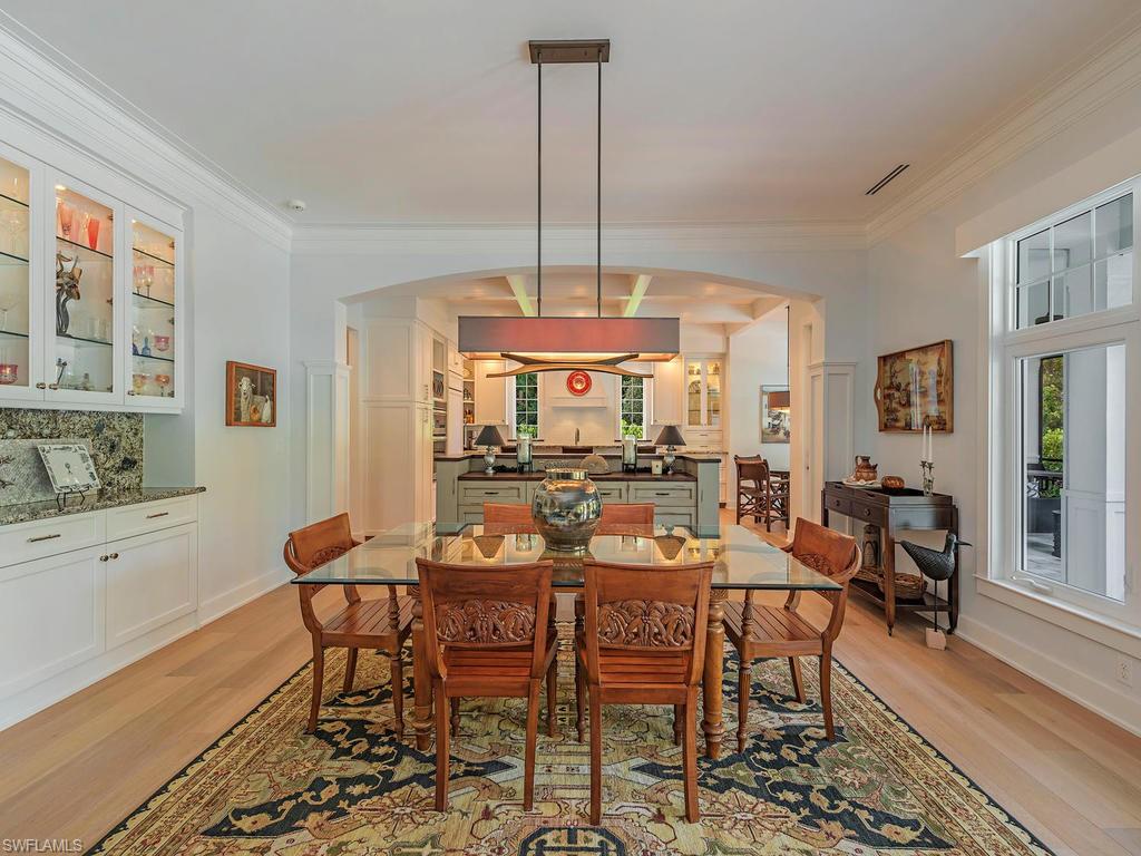 2305 Harrier Run Naples, FL 34105 - Photo 5 of 15 a view of a dining room with furniture window and wooden floor