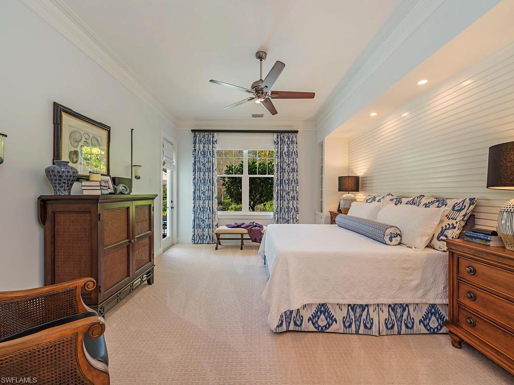 2305 Harrier Run Naples, FL 34105 - Photo 8 of 15 a bed room with a bed and furniture