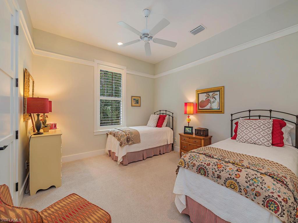 2305 Harrier Run Naples, FL 34105 - Photo 10 of 15 a bedroom with two beds and painted walls
