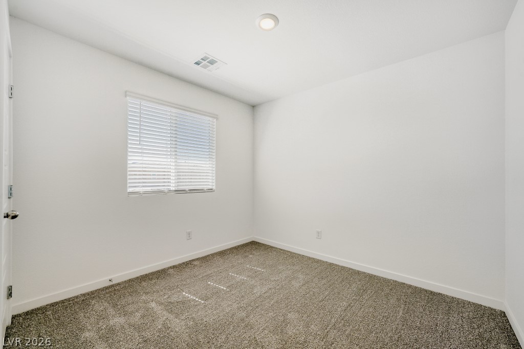 773 Fallen Phoenix Street Henderson, NV 89011 - Photo 19 of 28 Carpeted empty room featuring baseboards