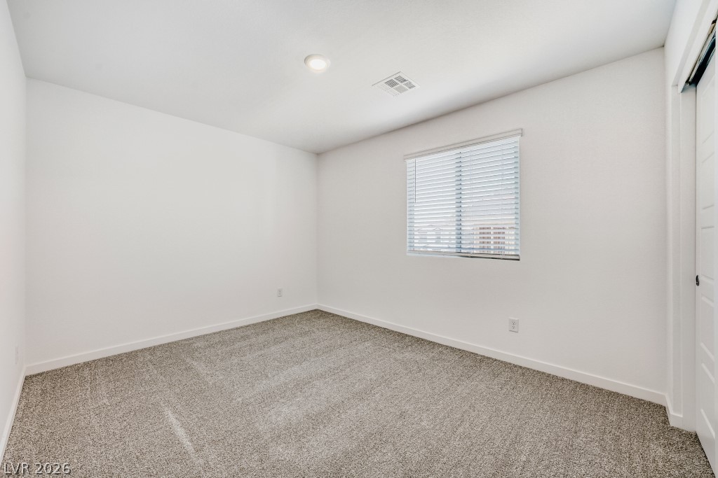 773 Fallen Phoenix Street Henderson, NV 89011 - Photo 21 of 28 Unfurnished room featuring baseboards and light colored carpet