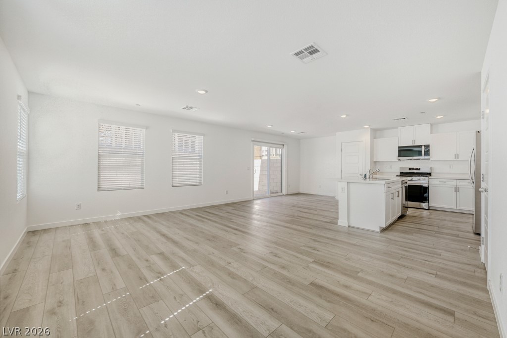 773 Fallen Phoenix Street Henderson, NV 89011 - Photo 5 of 28 Unfurnished living room with recessed lighting and light wood-style floors
