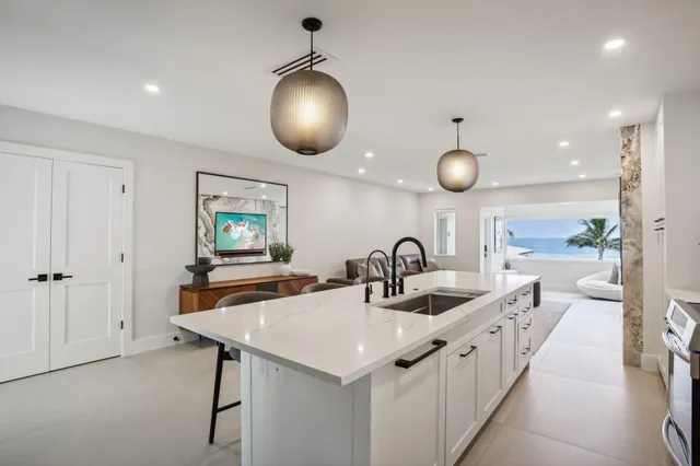 a spacious bedroom with a bed and a flat screen tv