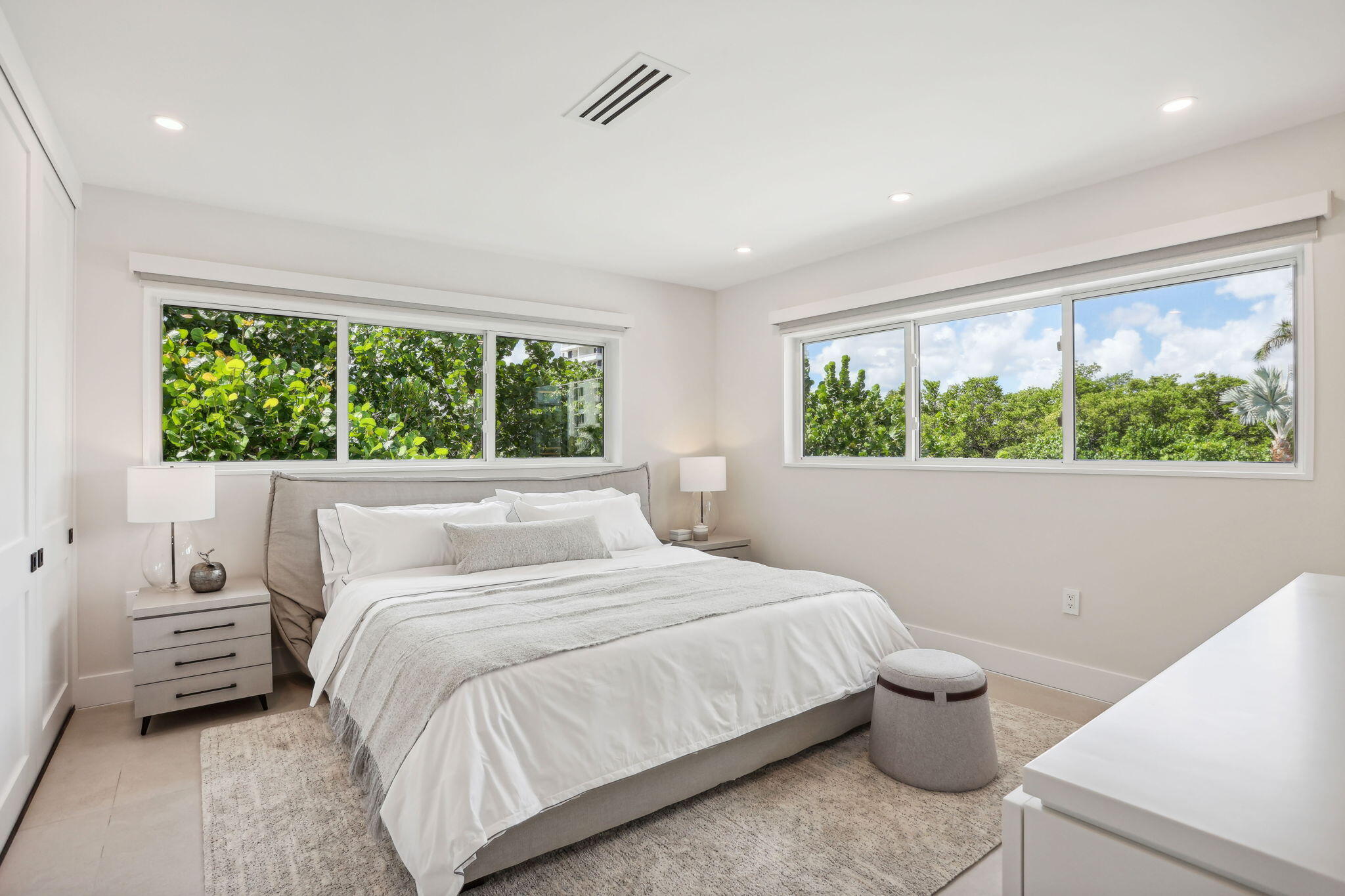 3401 South Ocean Boulevard, Unit 6 Highland Beach, FL 33487 - Photo 12 of 33 a bedroom with a bed and a large window