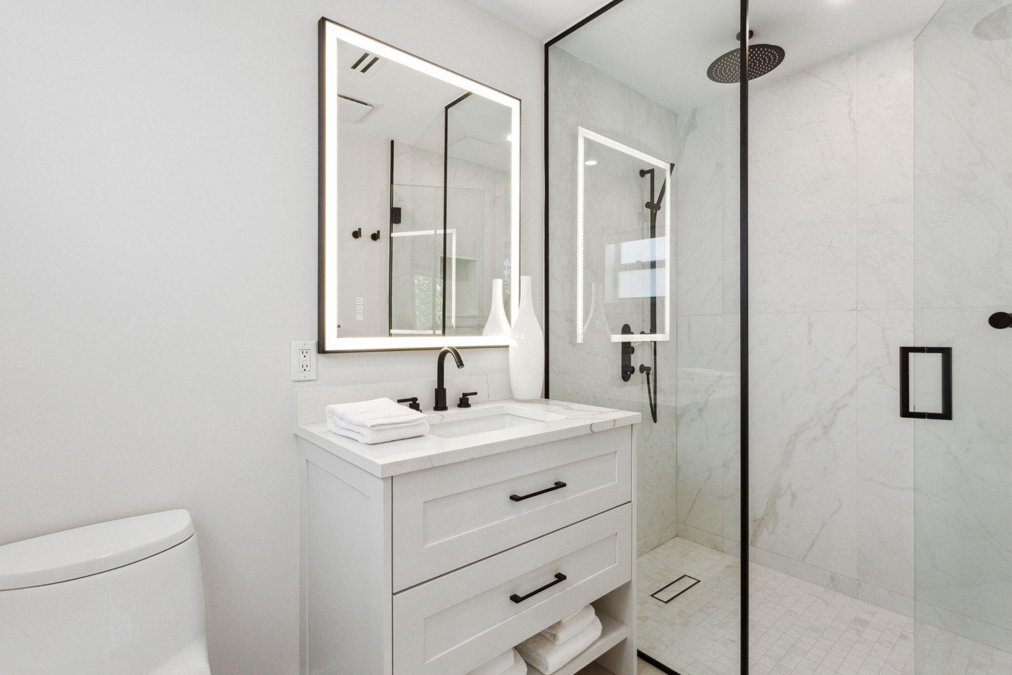 3401 South Ocean Boulevard, Unit 6 Highland Beach, FL 33487 - Photo 13 of 33 a bathroom with a sink and a mirror