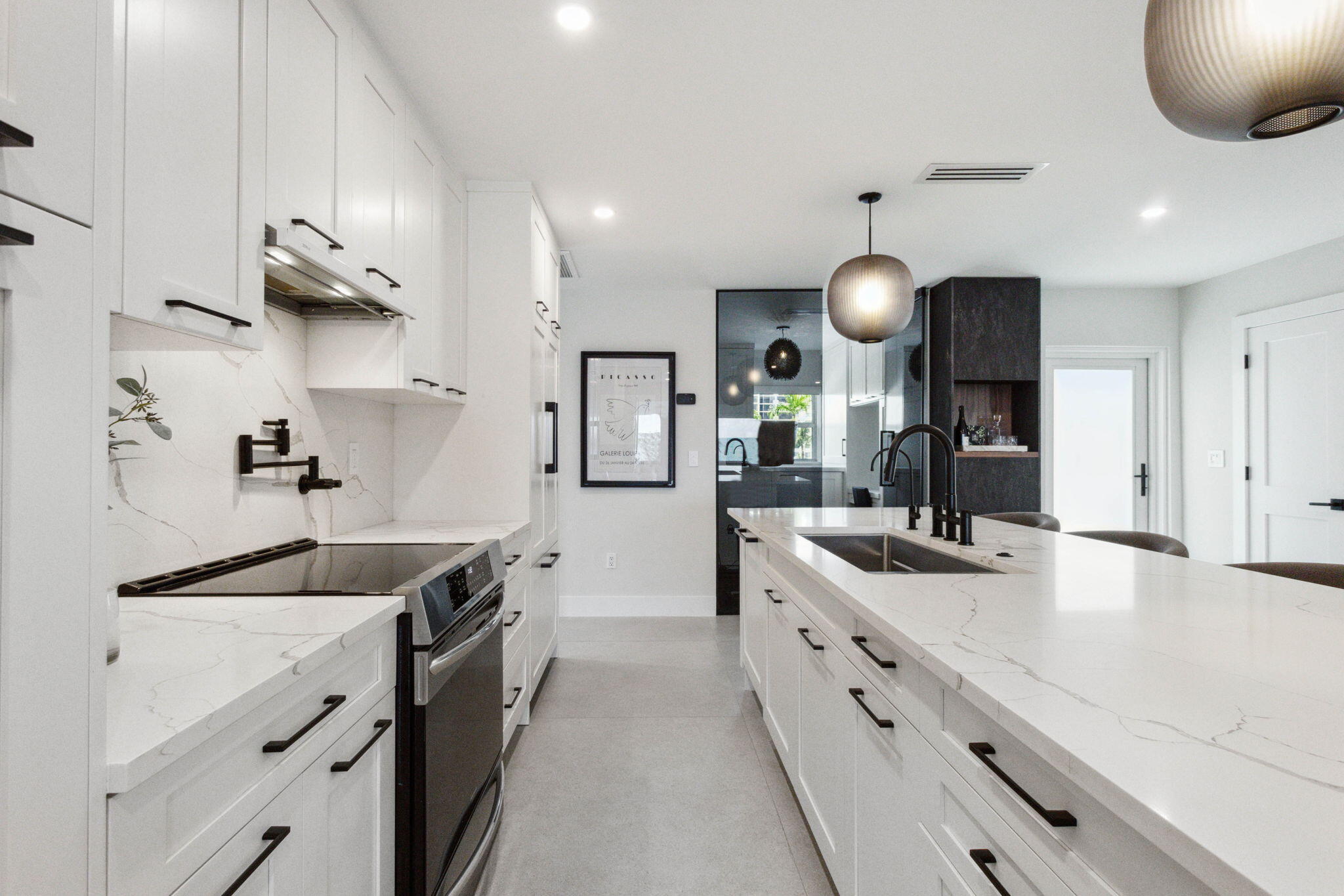 3401 South Ocean Boulevard, Unit 6 Highland Beach, FL 33487 - Photo 17 of 33 a kitchen with stainless steel appliances granite countertop a sink and a stove