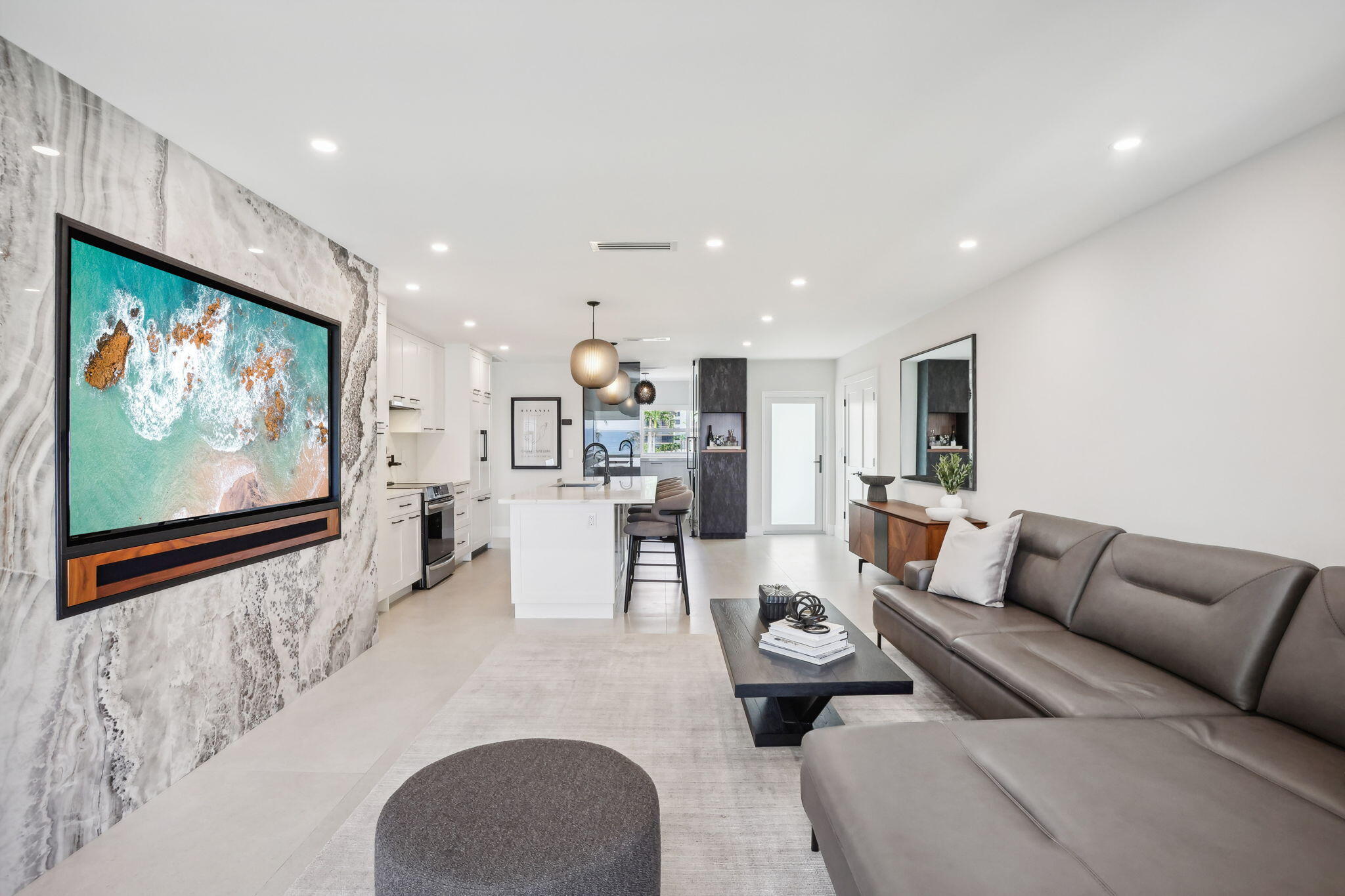 3401 South Ocean Boulevard, Unit 6 Highland Beach, FL 33487 - Photo 18 of 33 a living room with furniture and a flat screen tv