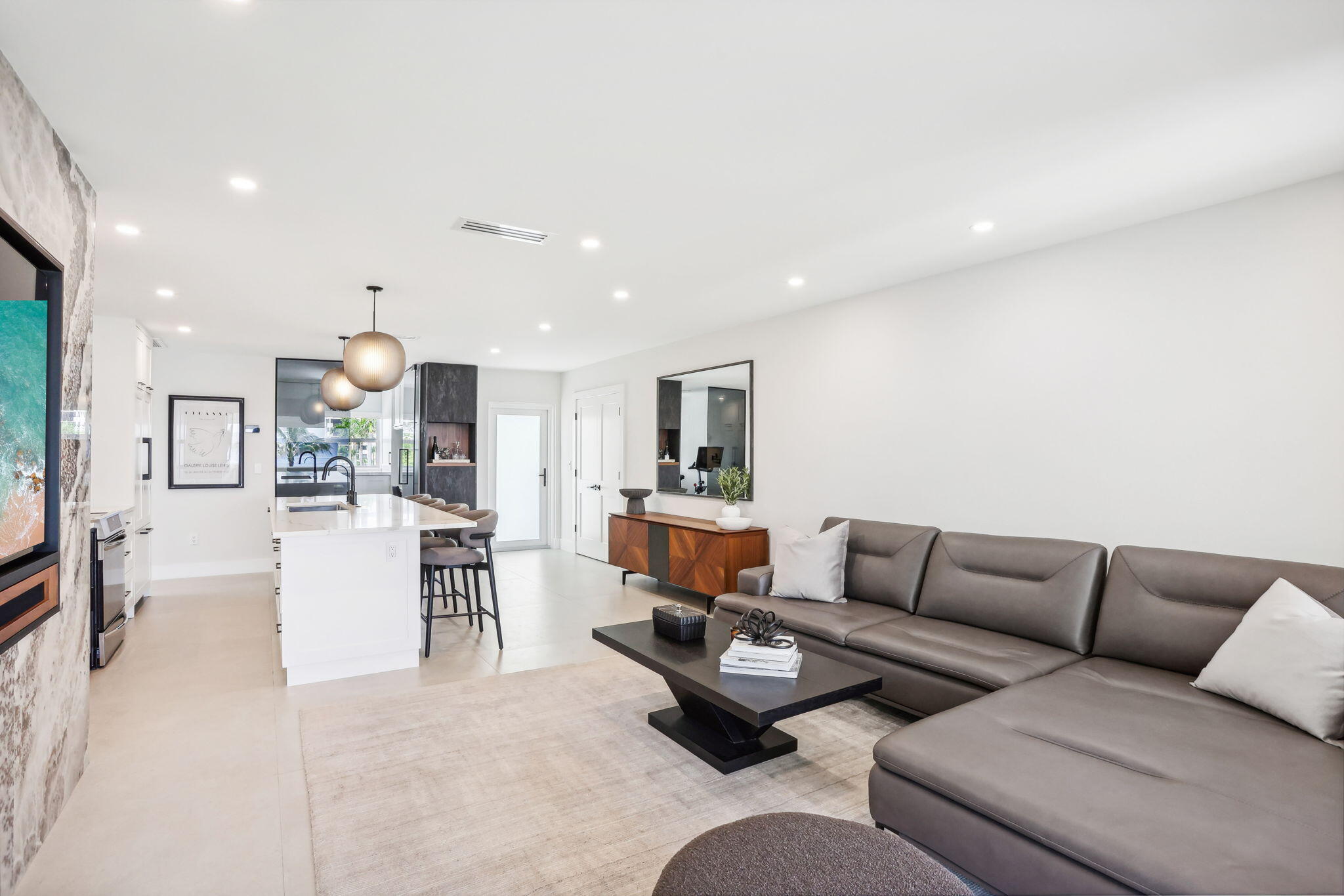 3401 South Ocean Boulevard, Unit 6 Highland Beach, FL 33487 - Photo 19 of 33 a living room with furniture and kitchen view