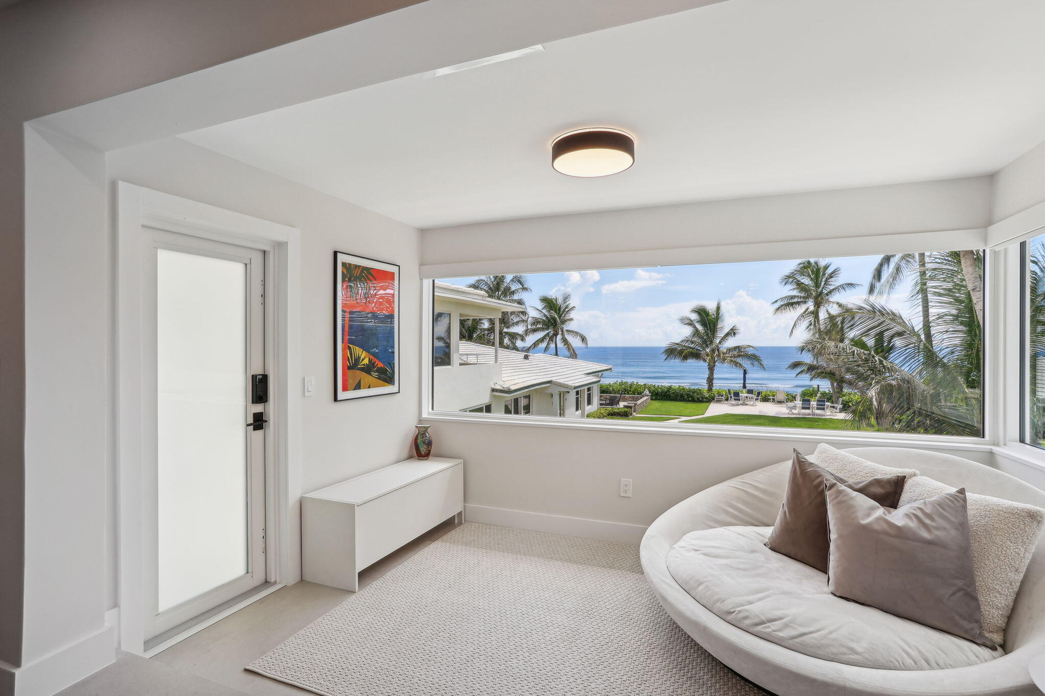 3401 South Ocean Boulevard, Unit 6 Highland Beach, FL 33487 - Photo 20 of 33 a living room with furniture and a large window