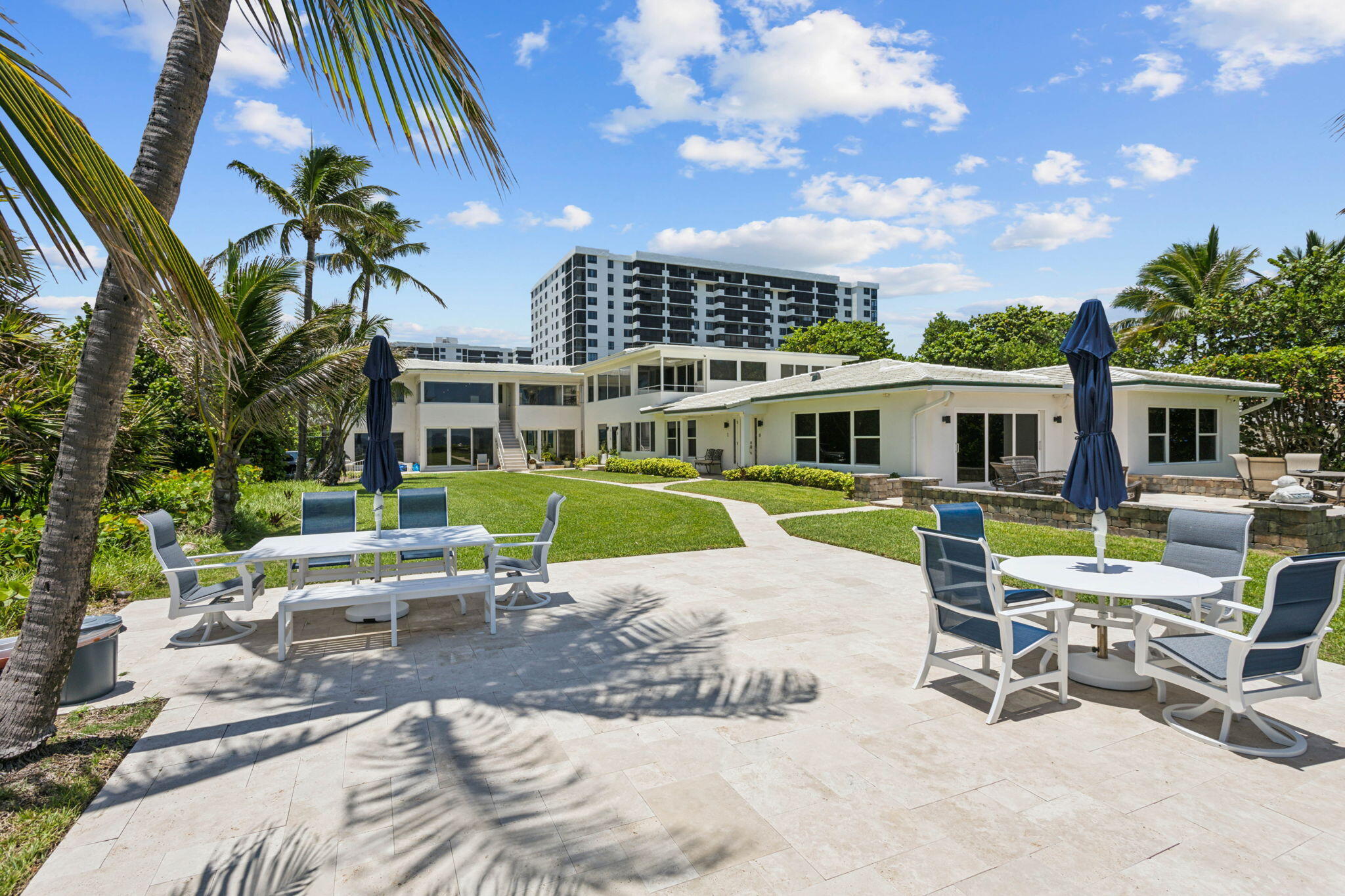 3401 South Ocean Boulevard, Unit 6 Highland Beach, FL 33487 - Photo 22 of 33 a view of a chairs and table in the patio