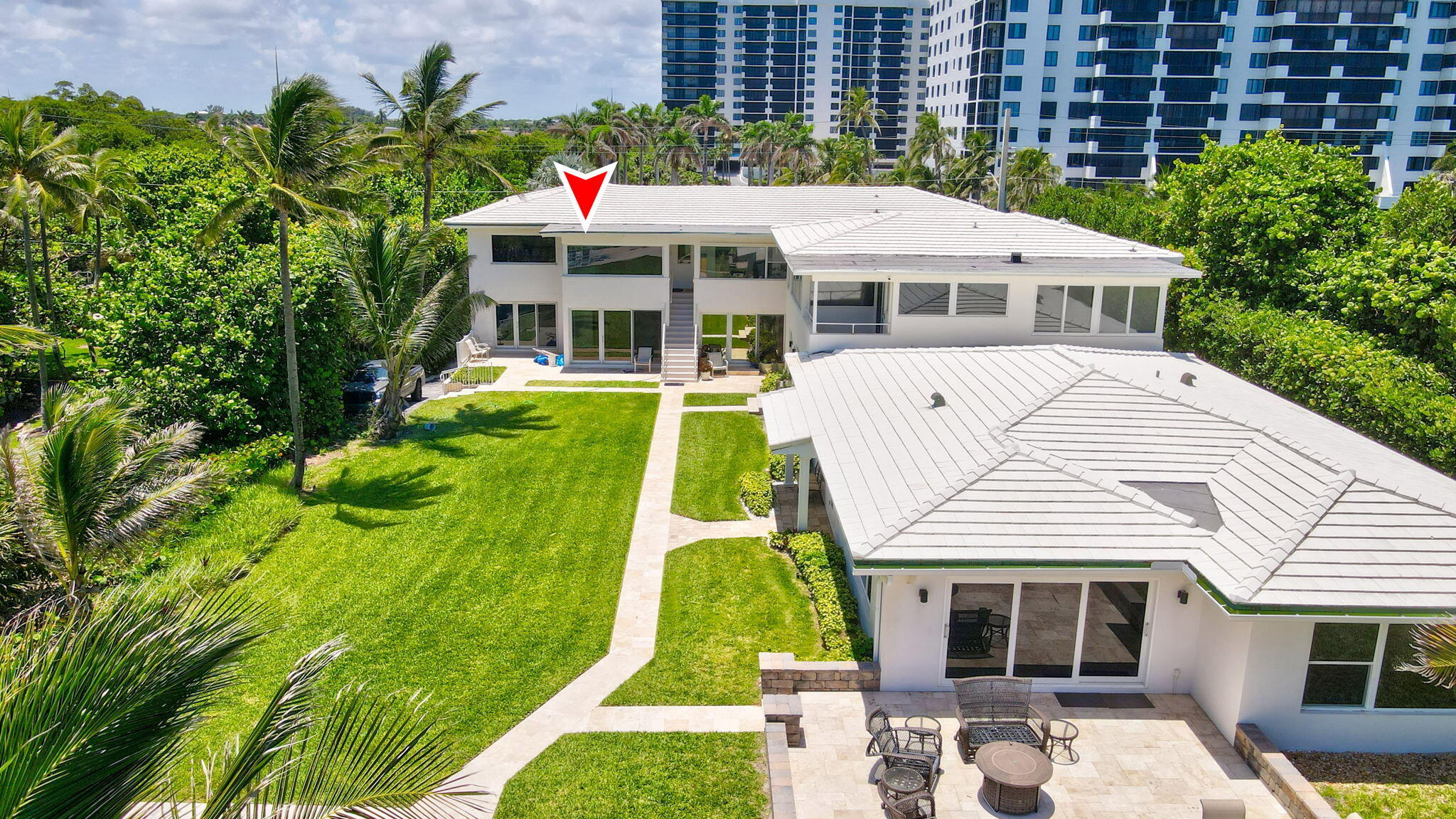 3401 South Ocean Boulevard, Unit 6 Highland Beach, FL 33487 - Photo 23 of 33 a front view of a house with a garden