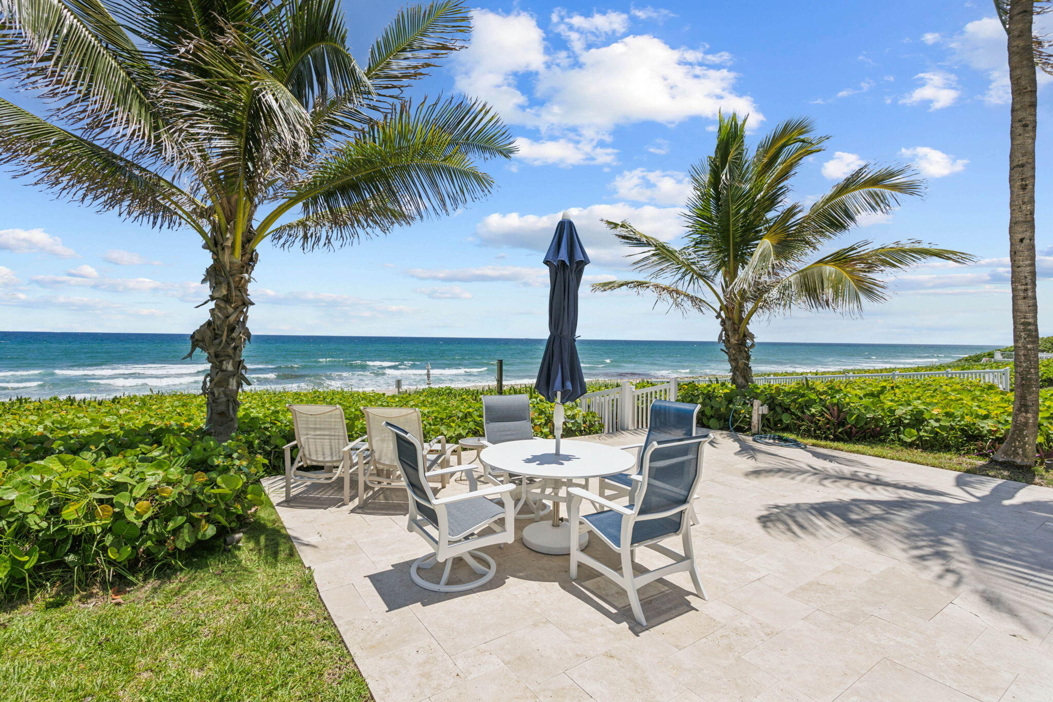 3401 South Ocean Boulevard, Unit 6 Highland Beach, FL 33487 - Photo 24 of 33 a view of an outdoor space with seating area and garden