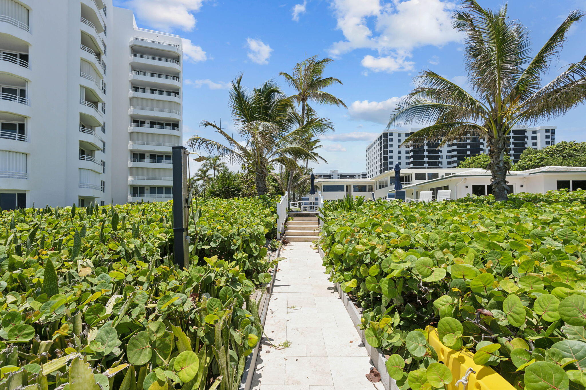 3401 South Ocean Boulevard, Unit 6 Highland Beach, FL 33487 - Photo 26 of 33 a view of a pathway with a building in the background