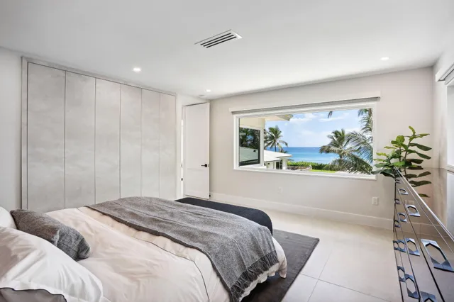 a bathroom with a double vanity sink mirror and shower