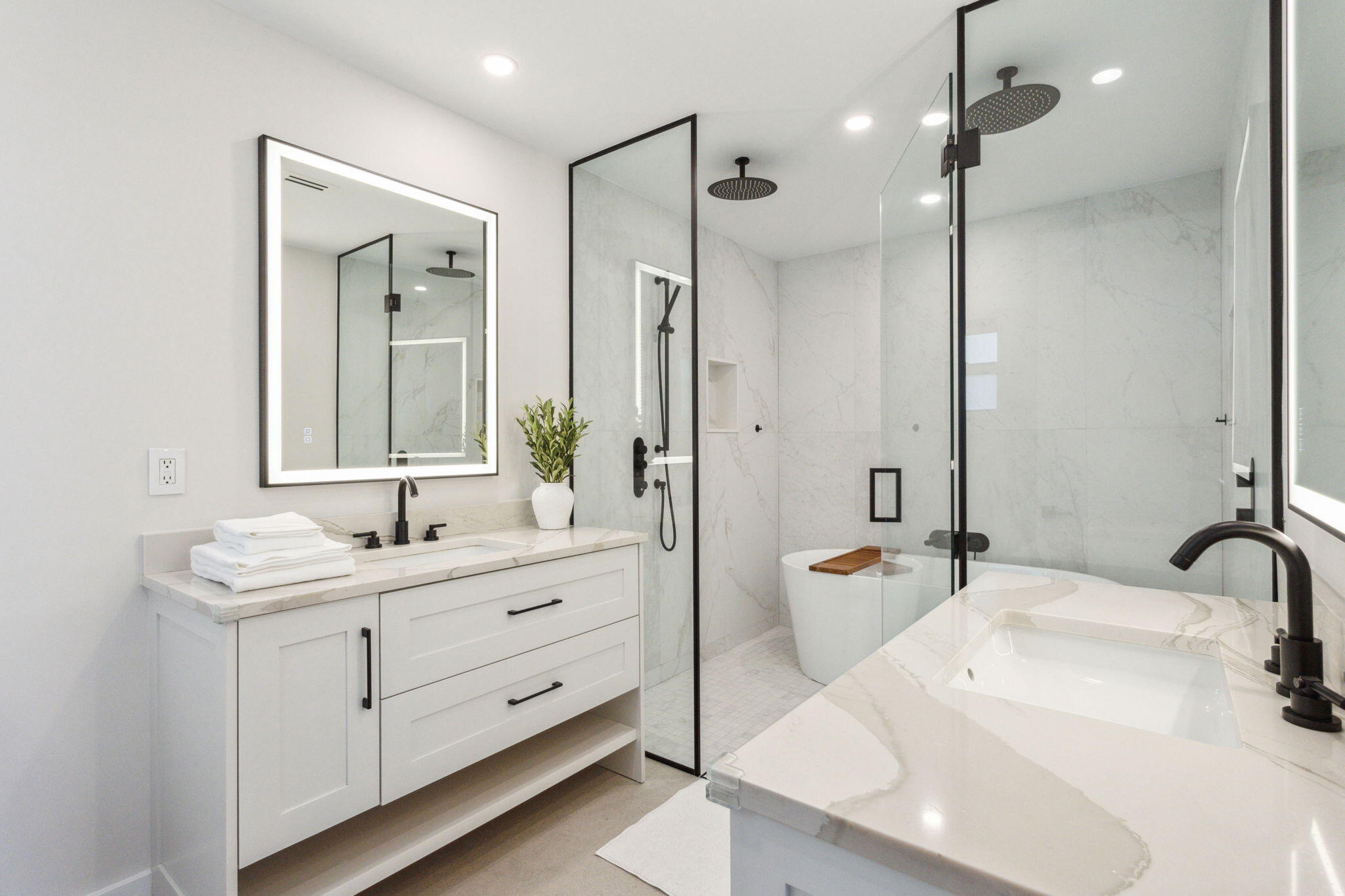 3401 South Ocean Boulevard, Unit 6 Highland Beach, FL 33487 - Photo 7 of 33 a en suite bathroom with double sink and a large mirror