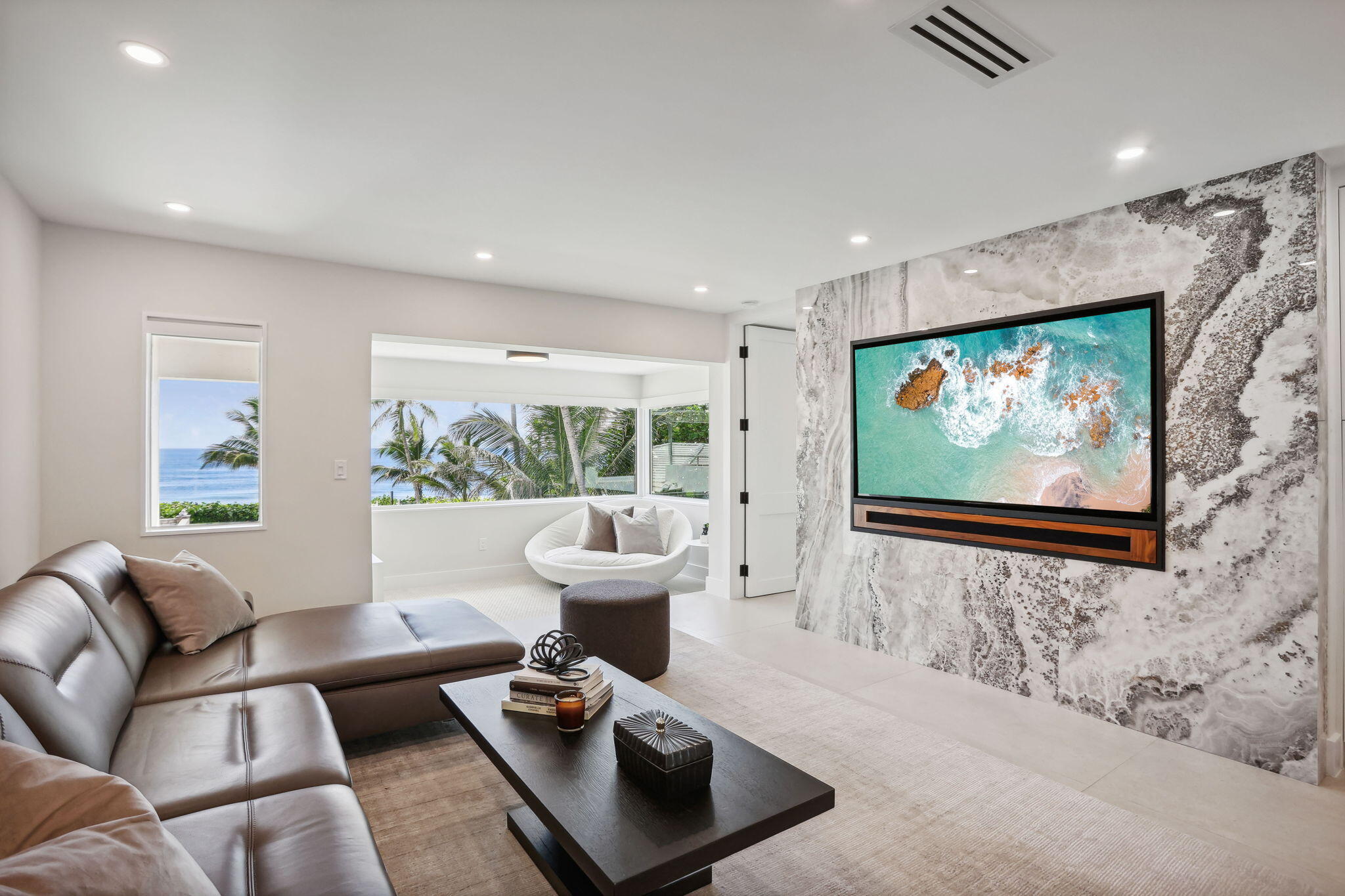 3401 South Ocean Boulevard, Unit 6 Highland Beach, FL 33487 - Photo 8 of 33 a living room with furniture and a flat screen tv