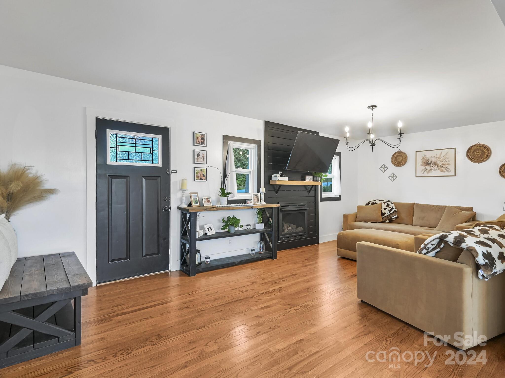 751 Queentown Road Canton, NC 28716 - Photo 10 of 31 a living room with furniture and a wooden floor