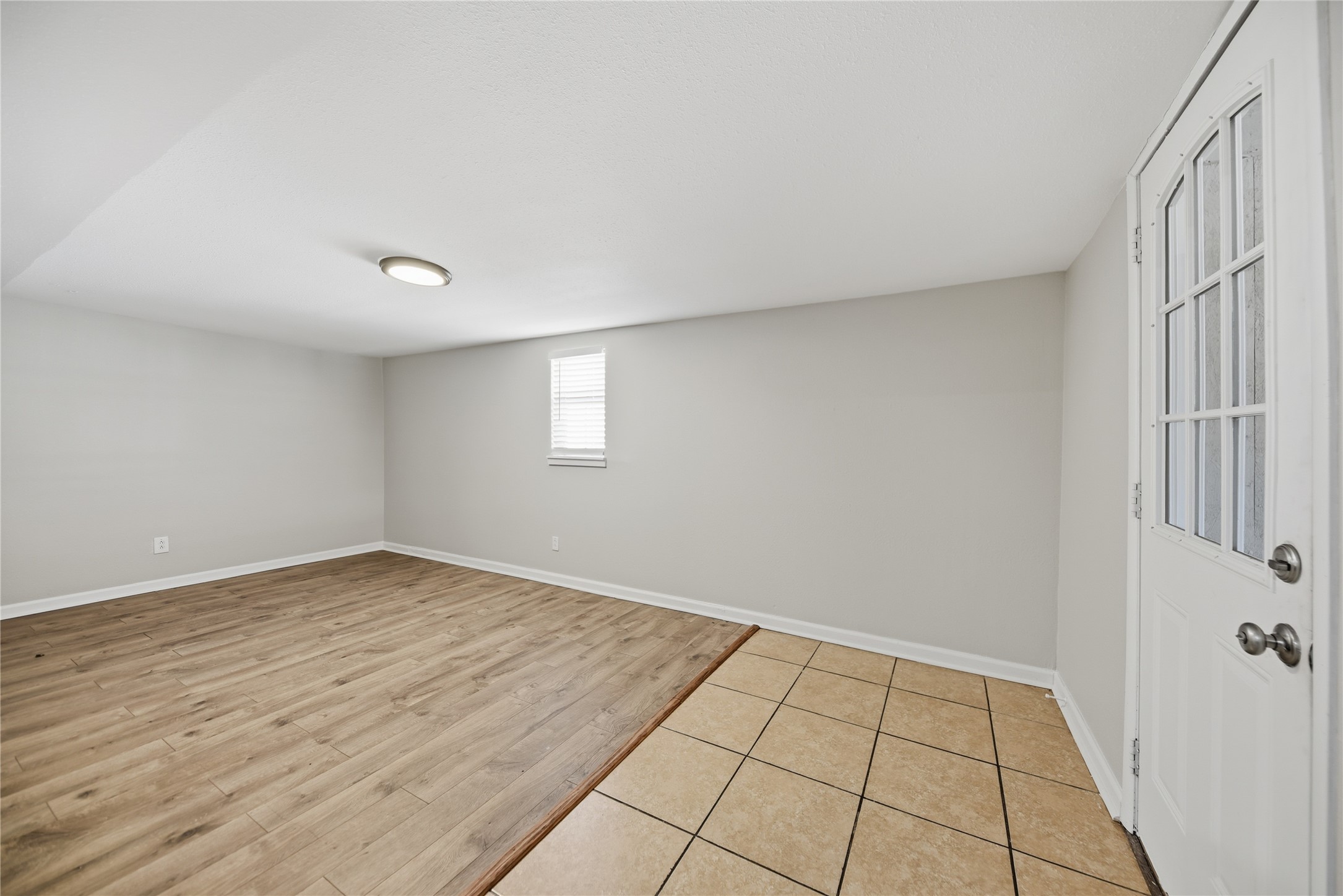 1702 Rampart Street Columbus, TX 78934 - Photo 31 of 38 Spare room featuring light wood finished floors and baseboards