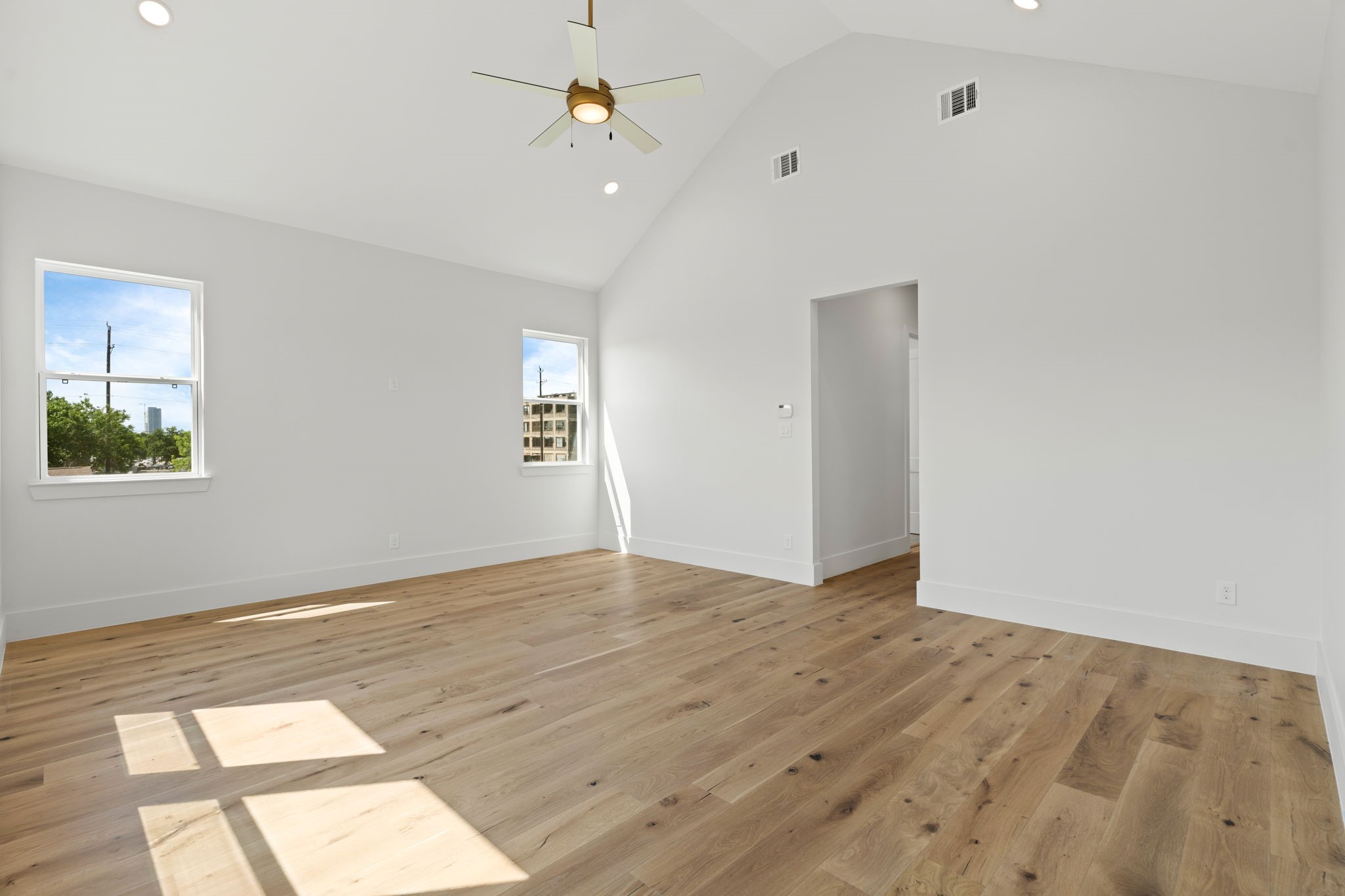 710 Waverly Street, Unit E Houston, TX 77007 - Photo 14 of 19 wooden floor in an empty room