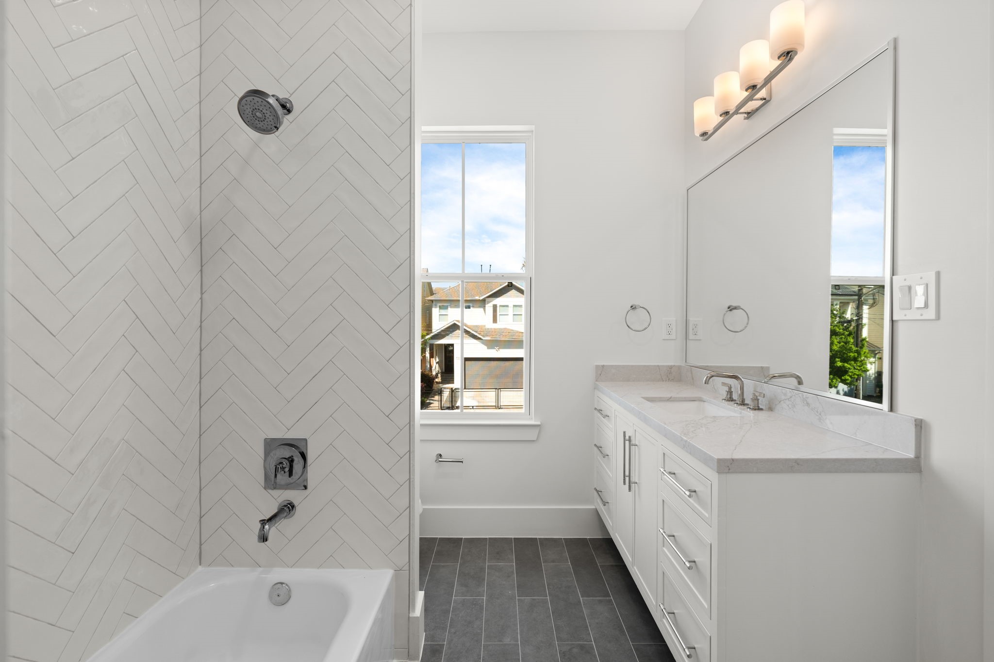 710 Waverly Street, Unit E Houston, TX 77007 - Photo 19 of 19 a bathroom with a tub sink and mirror