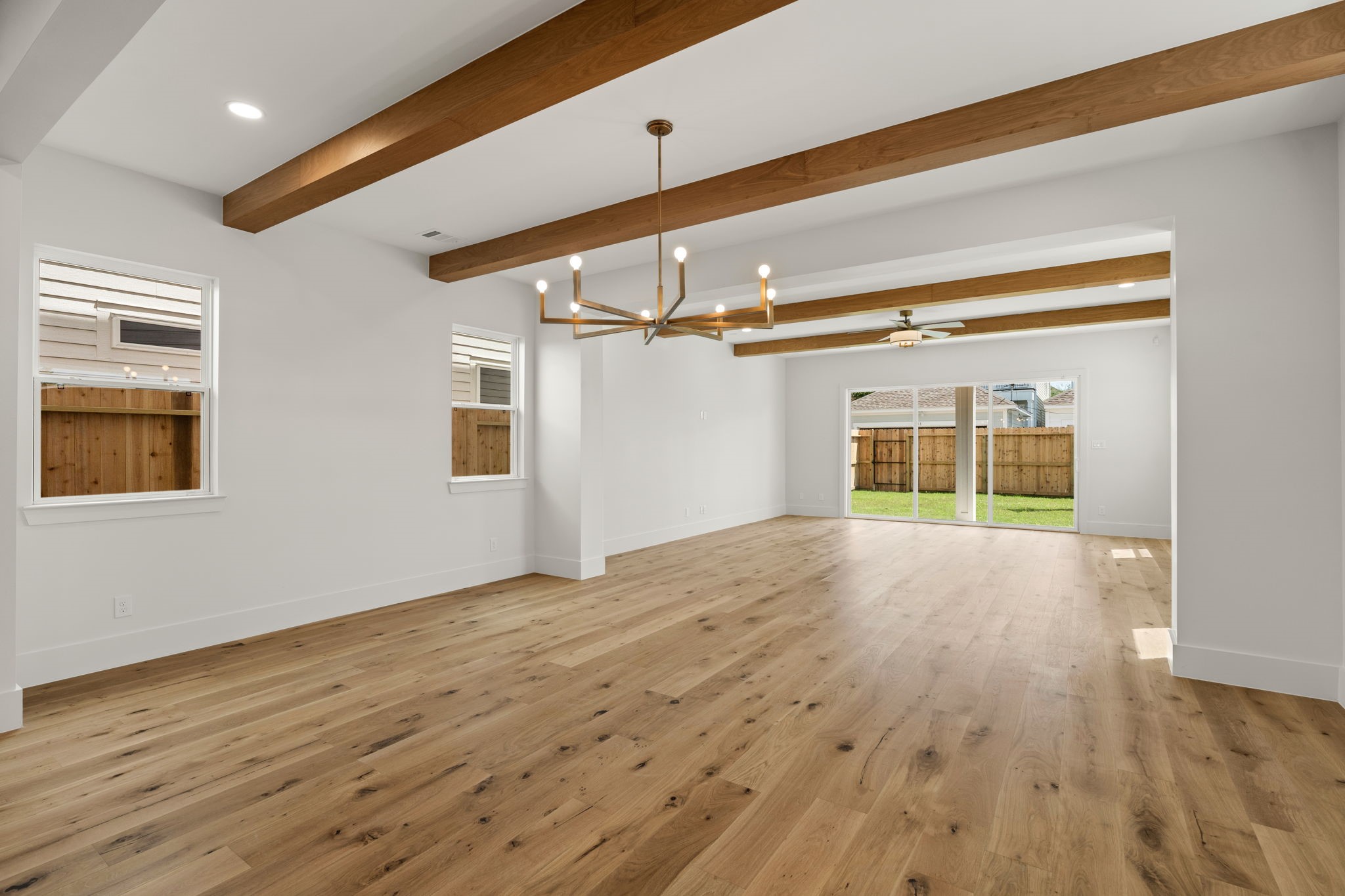 710 Waverly Street, Unit E Houston, TX 77007 - Photo 5 of 19 a view of empty room with wooden floor and fan
