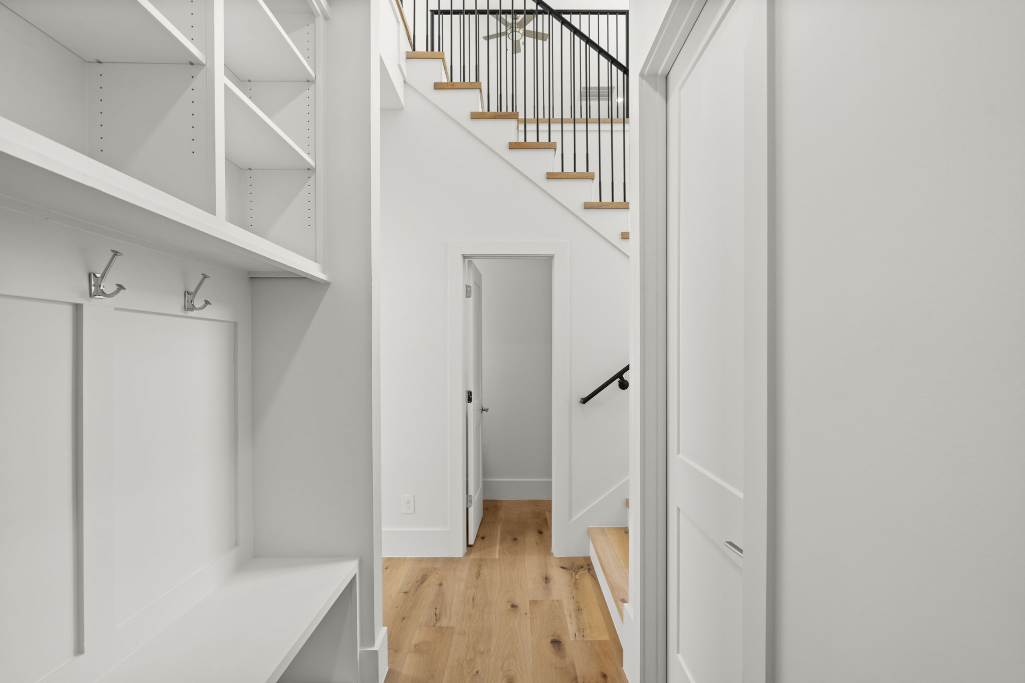 710 Waverly Street, Unit E Houston, TX 77007 - Photo 8 of 19 a view of a hallway with wooden floor and entryway