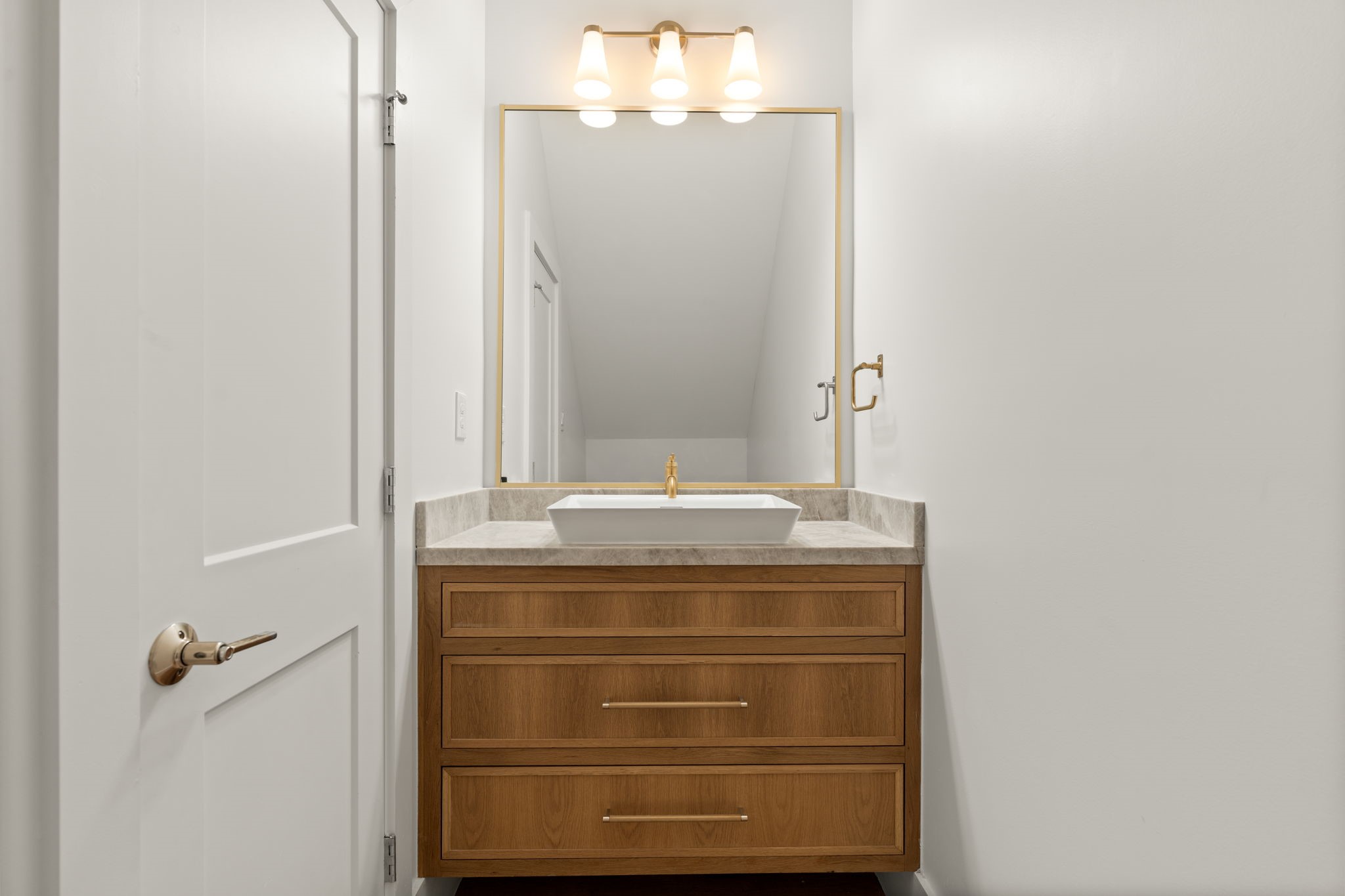 710 Waverly Street, Unit E Houston, TX 77007 - Photo 9 of 19 a bathroom with a granite countertop sink a mirror and a shower