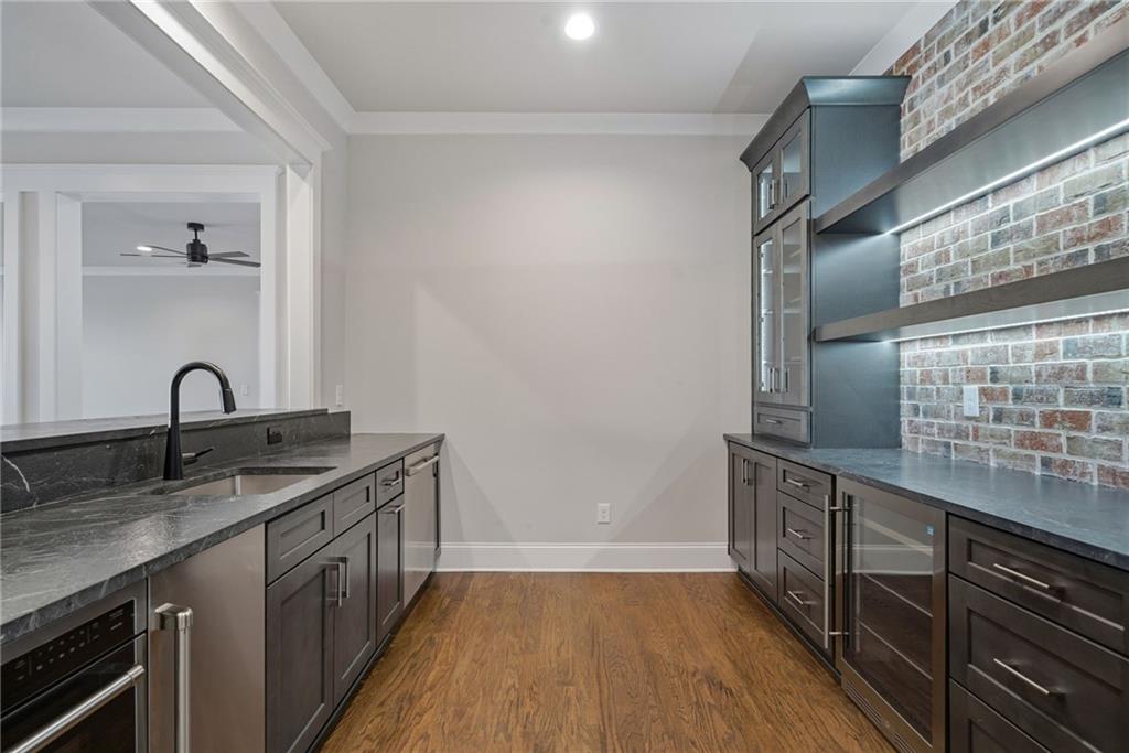 5364 Price Road Gainesville, GA 30506 - Photo 51 of 59 a kitchen with granite countertop a sink and cabinets
