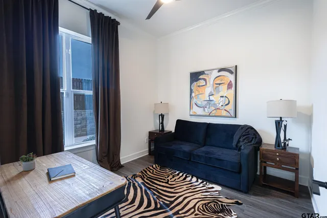 a bed room with a bed and a chair