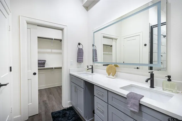 a bathroom with a shower and a glass door