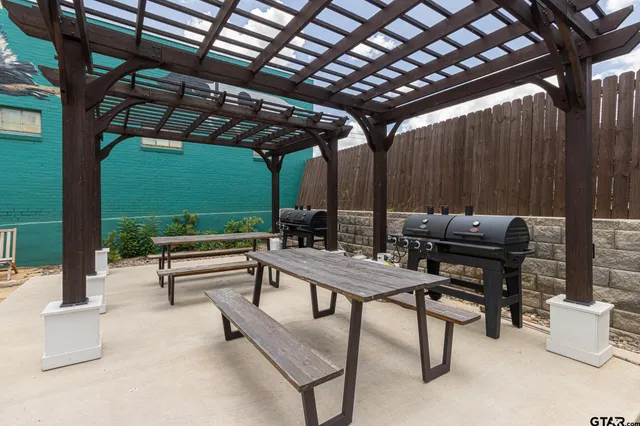 swimming pool view with a garden space