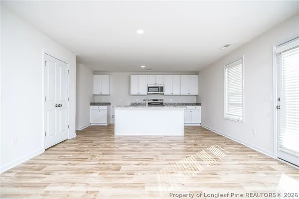 a view of kitchen with wooden floor