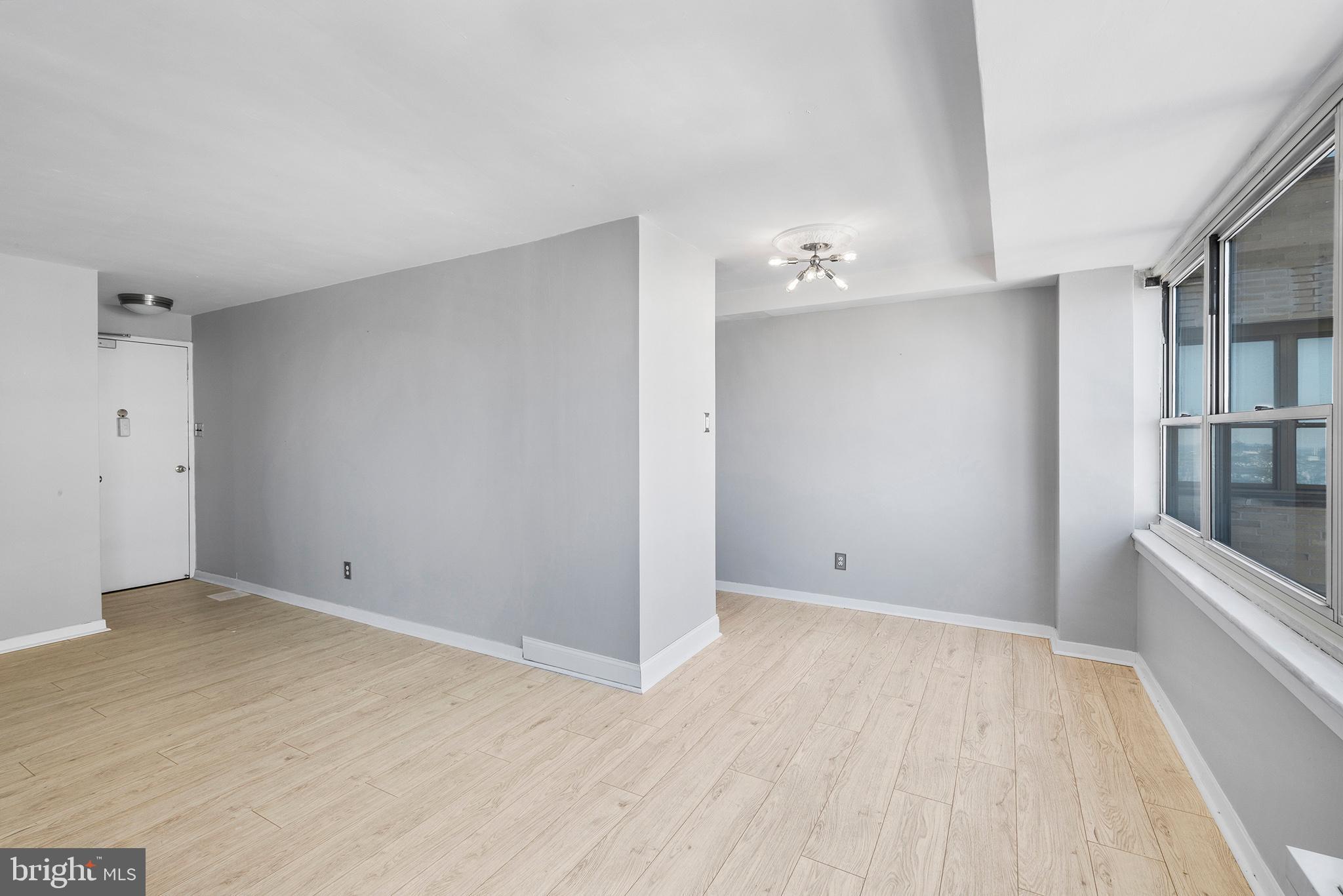 1810 Rittenhouse Square, Unit 1608 Philadelphia, PA 19103 - Photo 6 of 31 wooden floor in an empty room