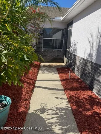 a view of a backyard of the house