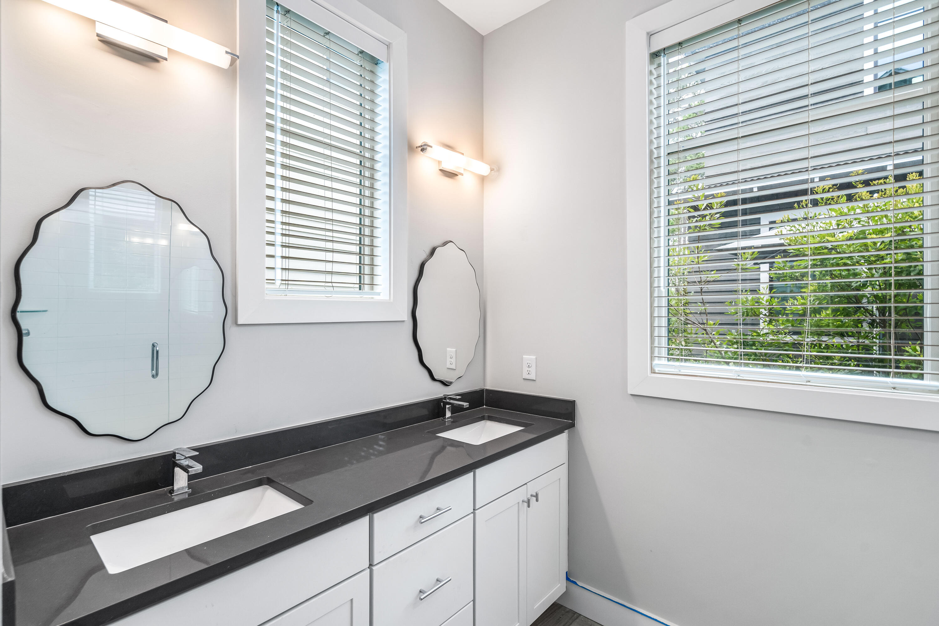61 Edens Landing Circle Santa Rosa Beach, FL 32459 - Photo 17 of 30 a bathroom with a sink and a mirror