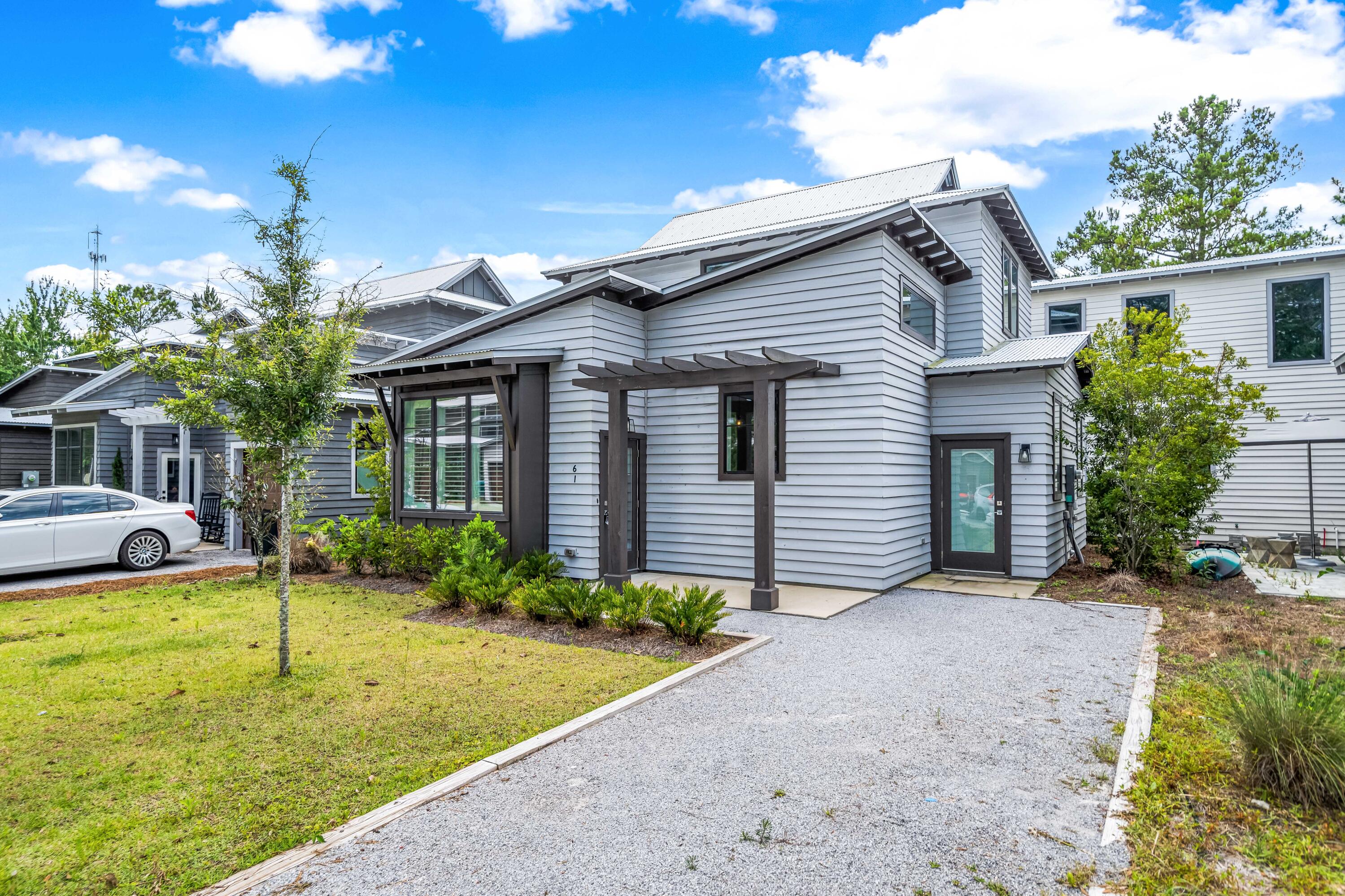 61 Edens Landing Circle Santa Rosa Beach, FL 32459 - Photo 2 of 30 a view of a house with backyard and porch
