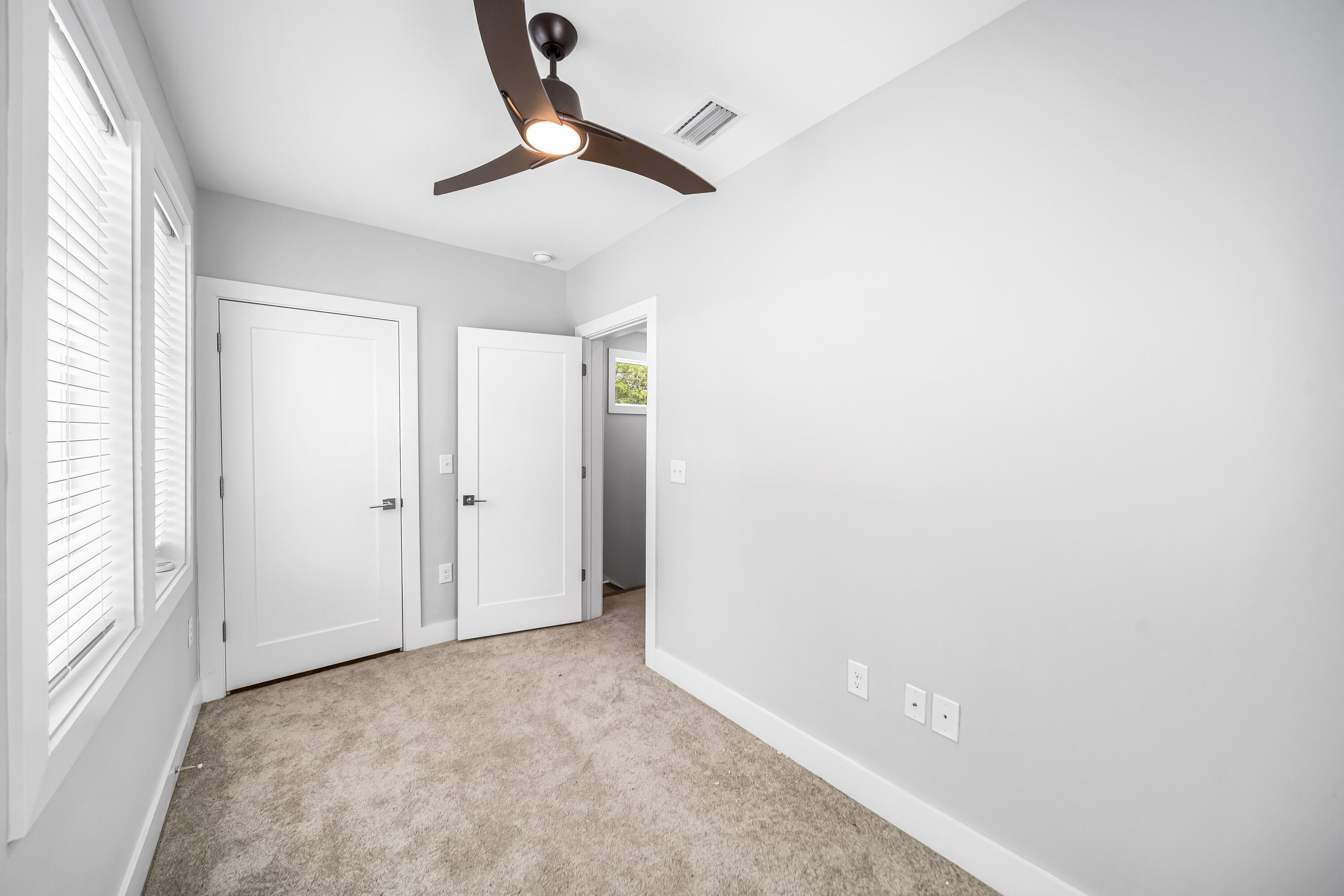 61 Edens Landing Circle Santa Rosa Beach, FL 32459 - Photo 24 of 30 a view of a livingroom with a ceiling fan & window