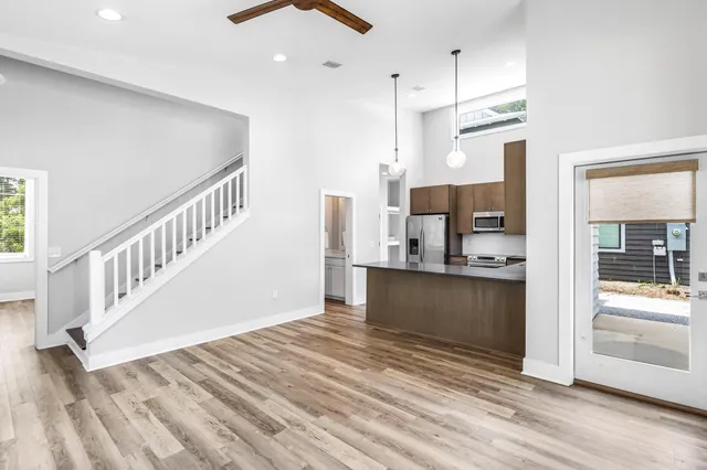 a view of kitchen with stainless steel appliances cabinets