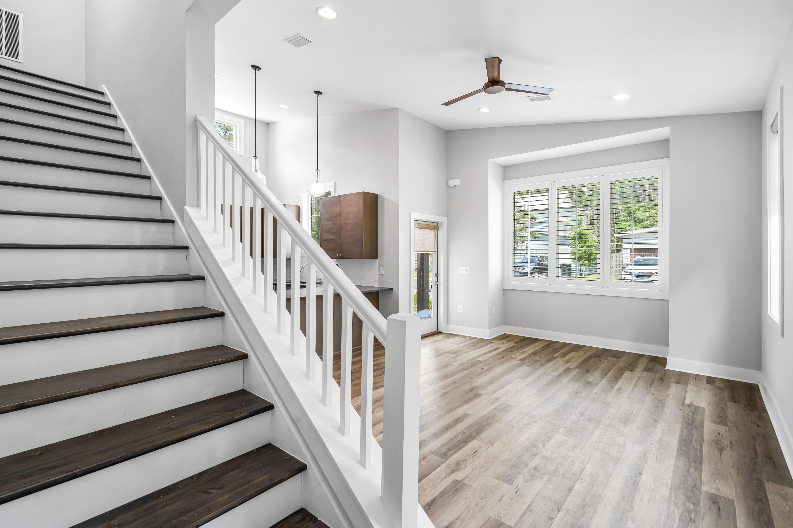 61 Edens Landing Circle Santa Rosa Beach, FL 32459 - Photo 9 of 30 wooden floor in an empty room with a window