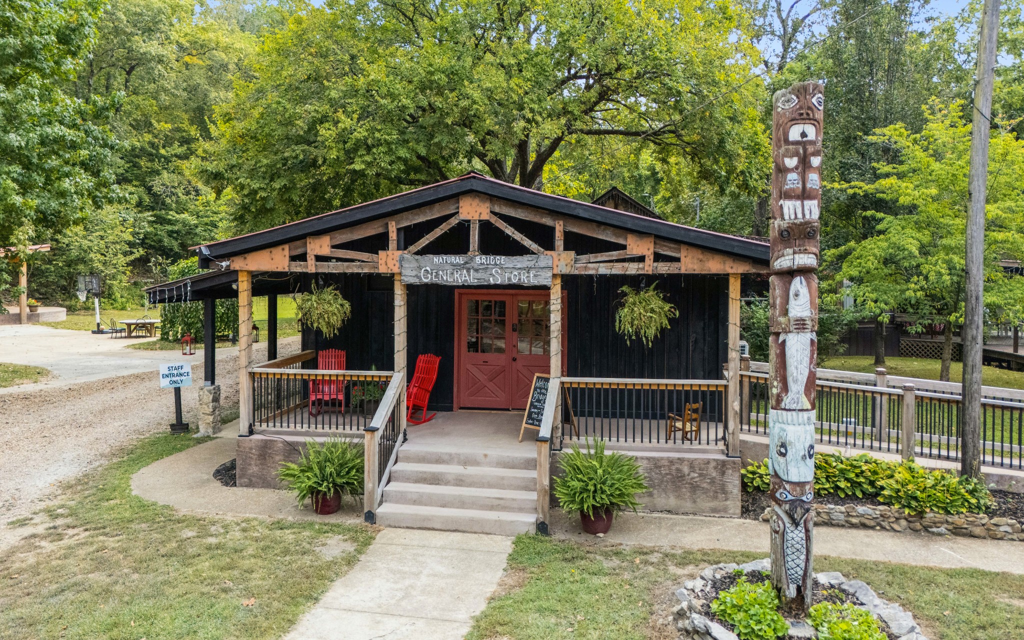 299 Natural Bridge Park Road Waynesboro, TN 38485 - Photo 18 of 63 a front view of a house with garden