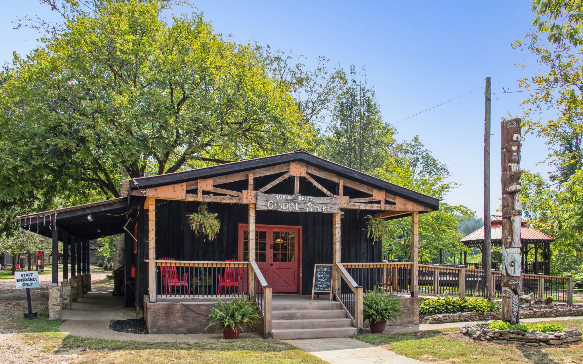 299 Natural Bridge Park Road Waynesboro, TN 38485 - Photo 20 of 63 a front view of a house with garden