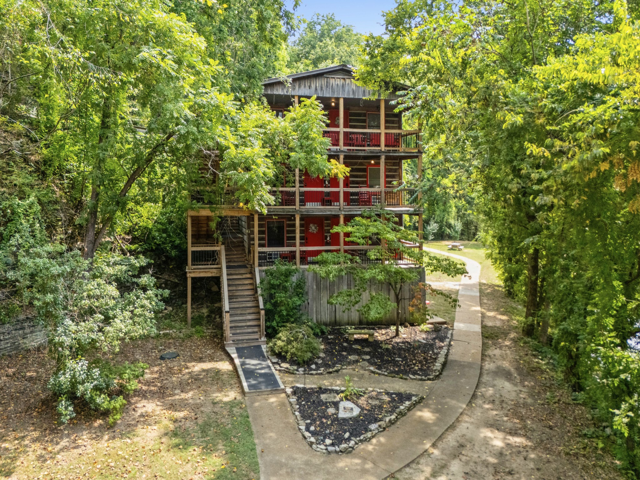 299 Natural Bridge Park Road Waynesboro, TN 38485 - Photo 34 of 63 a backyard of a house with lots of green space
